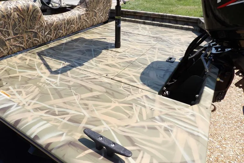 Slide: The Image of 2026 Crestliner 1760 Retriever SC boat with camouflage deck and seating. - 5