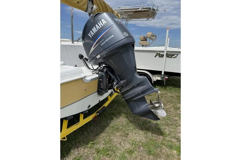 Slide: The Image of 2011 Hurricane SunDeck Sport 201 OB with Yamaha outboard motor on a trailer. - 3