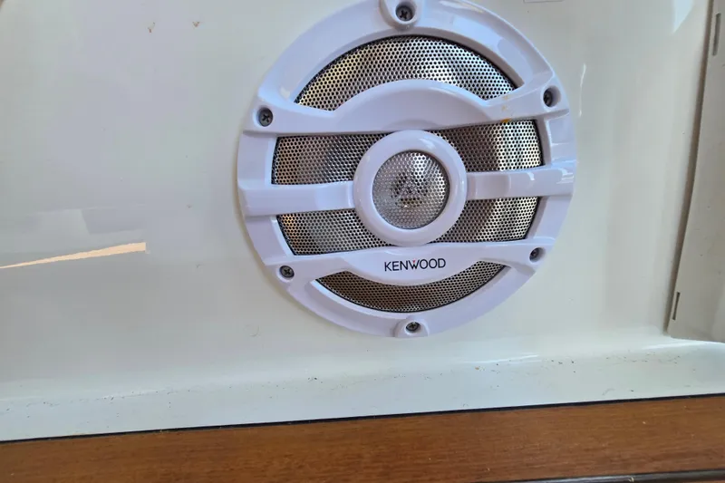 Slide: The Image of Kenwood speaker on 2016 Beneteau Oceanis 55 yacht, white casing, mounted on wooden panel. - 12