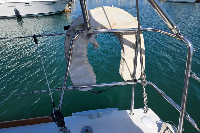 Slide: The Image of Life preserver on Beneteau Oceanis 55 yacht, 2016 model, docked in marina. - 13