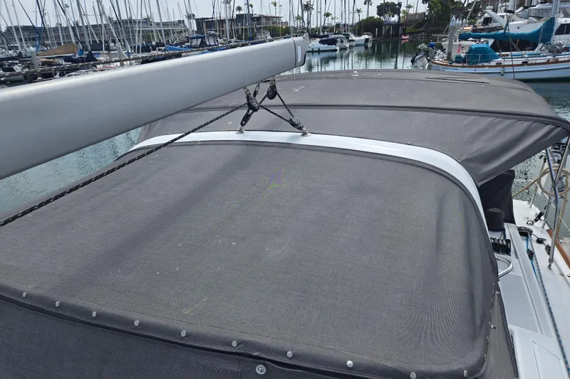Slide: The Image of Beneteau Oceanis 55 sailboat deck with canopy, docked in marina, 2016 model. - 18