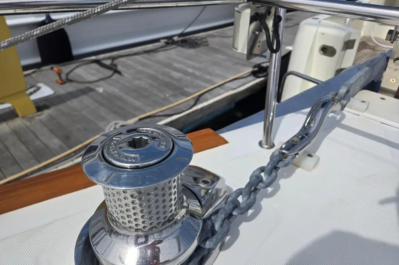 Slide: The Image of Anchor winch on 2016 Beneteau Oceanis 55 yacht deck, docked at marina. - 22