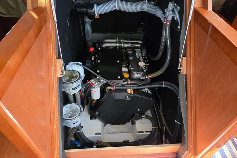 Slide: The Image of Engine compartment of a 2016 Beneteau Oceanis 55 sailboat, showcasing mechanical components. - 30