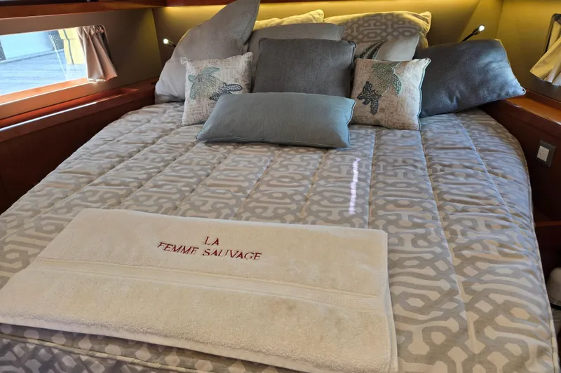 Slide: The Image of Luxurious cabin interior of 2016 Beneteau Oceanis 55 yacht with elegant bedding and decor. - 32