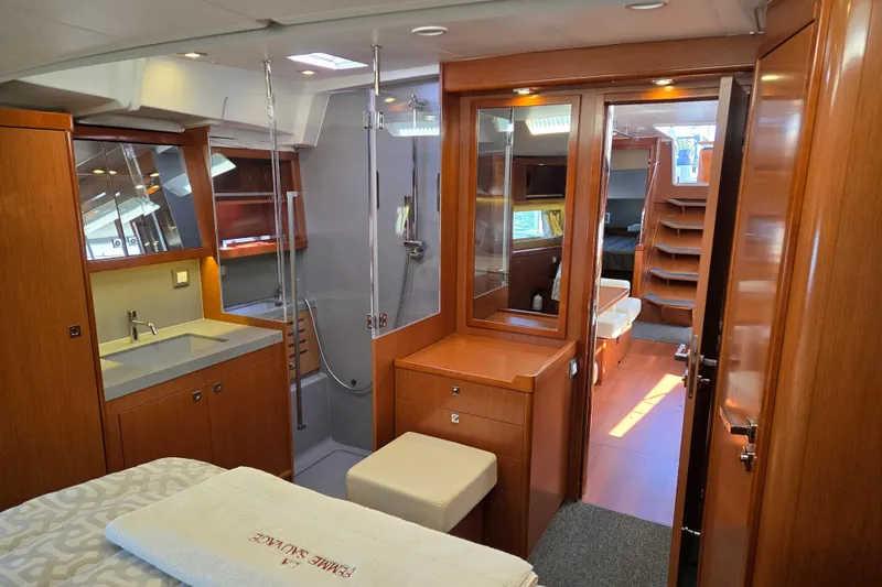 Slide: The Image of Luxurious interior of 2016 Beneteau Oceanis 55 yacht, featuring wood finishes and modern amenities. - 33