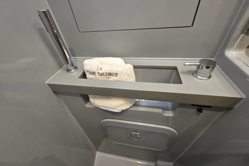 Slide: The Image of Modern bathroom sink on 2016 Beneteau Oceanis 55 yacht with towel and chrome fixtures. - 41