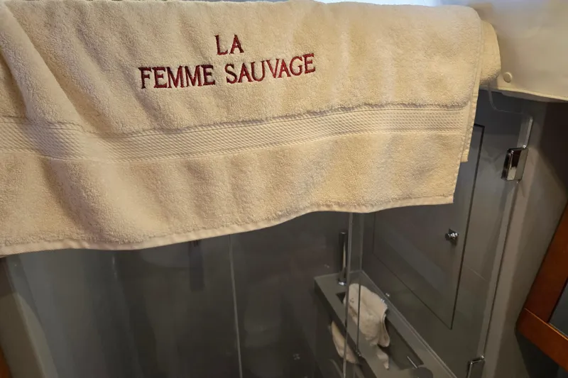 Slide: The Image of Towel with "La Femme Sauvage" embroidery on Beneteau Oceanis 55 yacht, 2016 model. - 42
