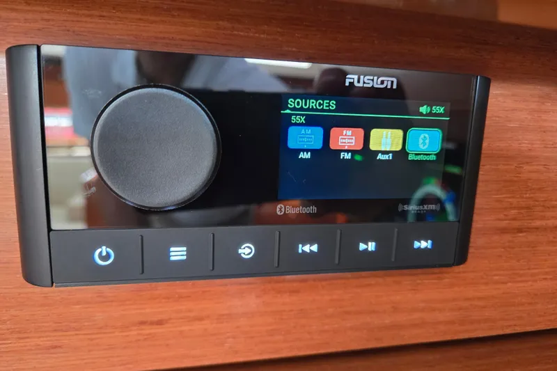 Slide: The Image of Fusion audio system interface on 2016 Beneteau Oceanis 55 yacht, displaying source options. - 45