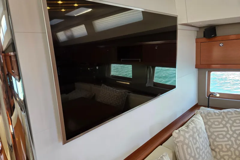 Slide: The Image of Luxurious interior of 2016 Beneteau Oceanis 55 yacht with modern decor and large window. - 53