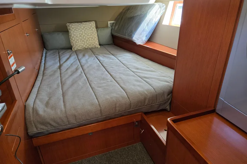 Slide: The Image of Cozy cabin interior of 2016 Beneteau Oceanis 55 yacht with comfortable bedding. - 55