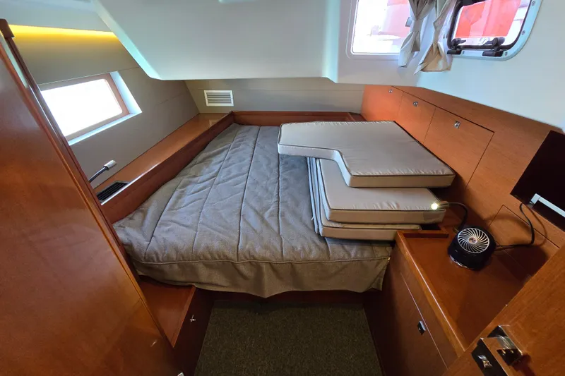 Slide: The Image of Interior cabin of 2016 Beneteau Oceanis 55 yacht with bed and cushions. - 59