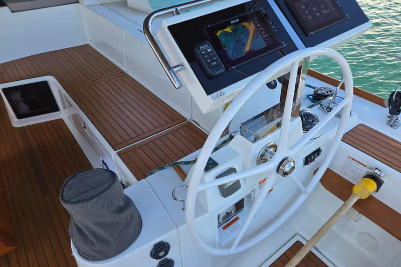 Slide: The Image of Steering wheel and navigation controls on a 2016 Beneteau Oceanis 55 yacht. - 7