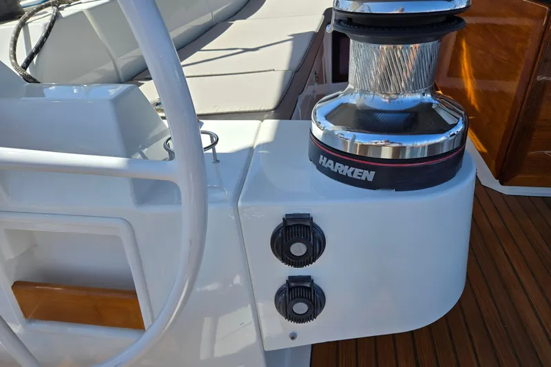 Slide: The Image of Steering wheel and winch on 2016 Beneteau Oceanis 55 yacht deck. - 9