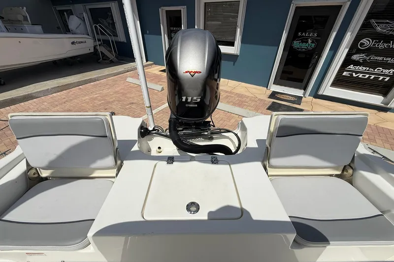 Slide: The Image of 2021 NauticStar 191 Hybrid boat with Yamaha 115 engine, docked near sales office. - 10