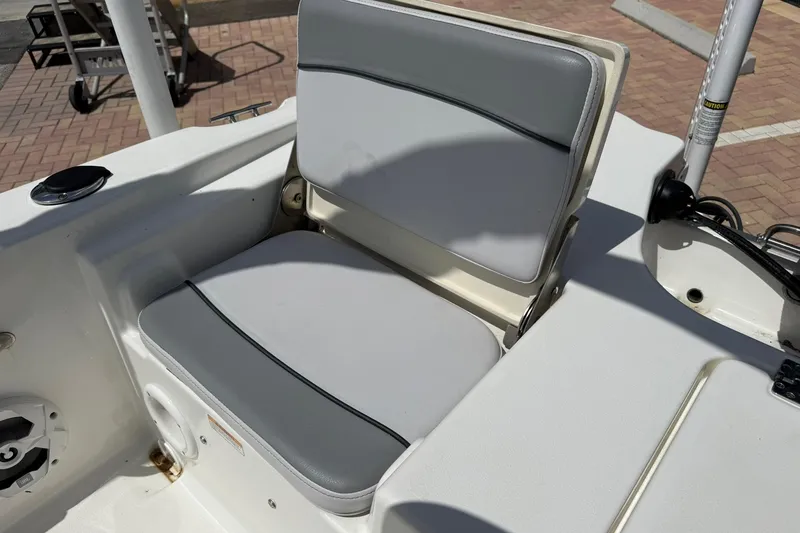 Slide: The Image of 2021 NauticStar 191 Hybrid boat seat with gray and white upholstery. - 11