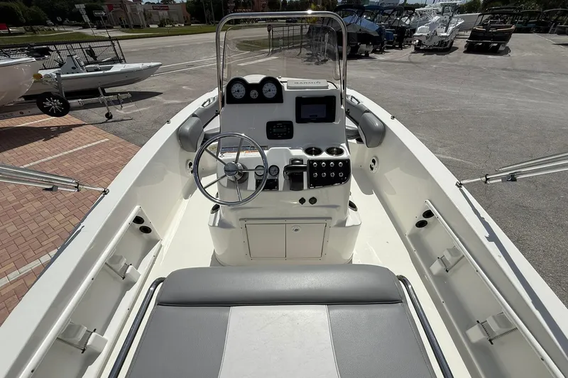 Slide: The Image of 2021 NauticStar 191 Hybrid boat interior with steering console and seating. - 14