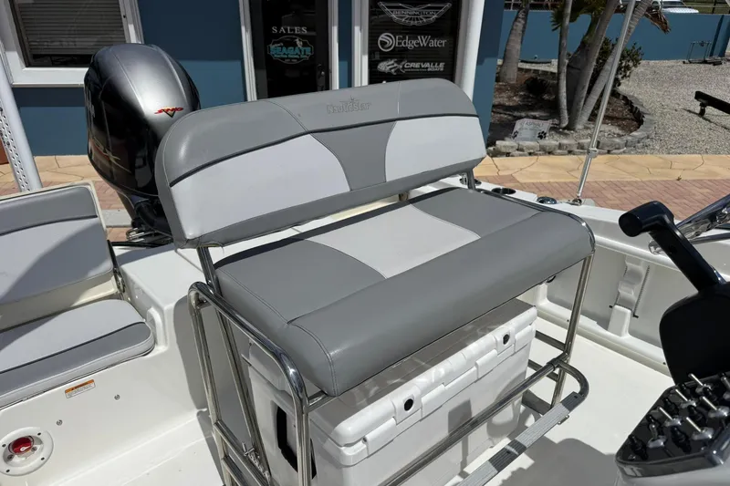 Slide: The Image of 2021 NauticStar 191 Hybrid boat interior with seating and console controls. - 17