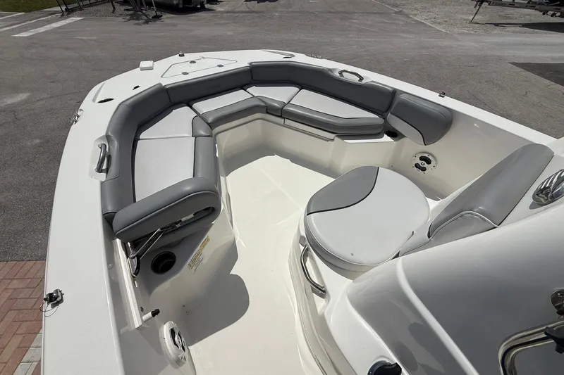Slide: The Image of 2021 NauticStar 191 Hybrid boat interior with gray seating and white deck. - 20