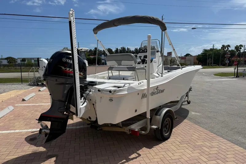 Slide: The Image of 2021 NauticStar 191 Hybrid boat with Yamaha outboard motor on a trailer. - 5