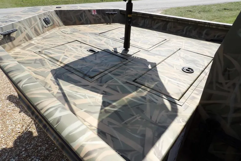 Slide: The Image of 2026 Crestliner 1760 Retriever FCC boat with camouflage deck design. - 15