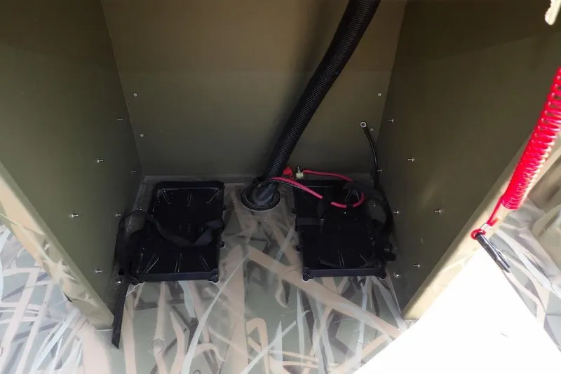 Slide: The Image of Interior view of 2026 Crestliner 1760 Retriever FCC boat's battery compartment. - 18