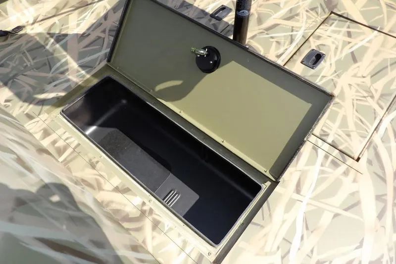 Slide: The Image of Open storage compartment in 2026 Crestliner 1760 Retriever FCC boat. - 20