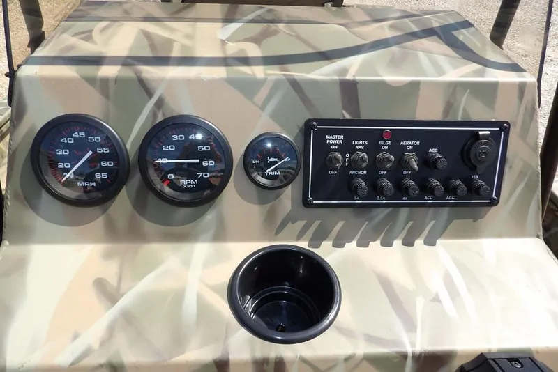 Slide: The Image of Dashboard of 2026 Crestliner 1760 Retriever FCC with gauges and control panel. - 23