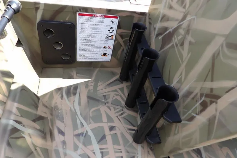 Slide: The Image of Crestliner 1760 Retriever FCC 2026 boat interior with rod holders and safety instructions. - 28