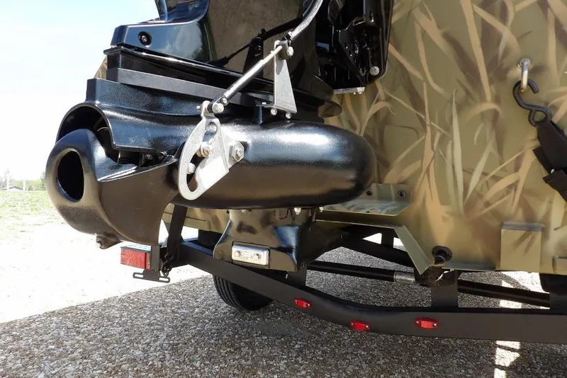 Slide: The Image of 2026 Crestliner 1760 Retriever FCC boat with camo design and motor detail. - 30