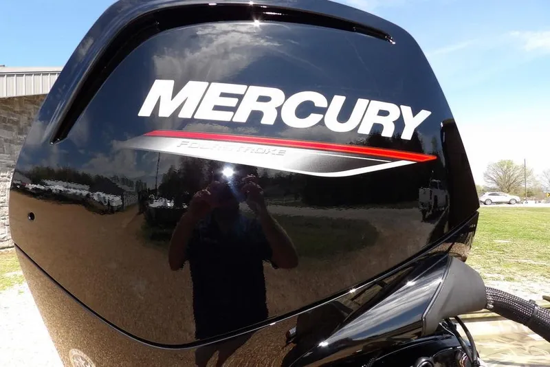 Slide: The Image of Mercury FourStroke engine on 2026 Crestliner 1760 Retriever FCC boat, reflecting outdoor scenery. - 31