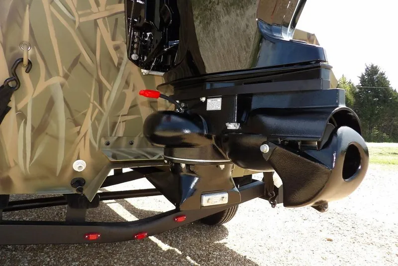 Slide: The Image of 2026 Crestliner 1760 Retriever FCC boat with camo design and powerful outboard motor. - 34