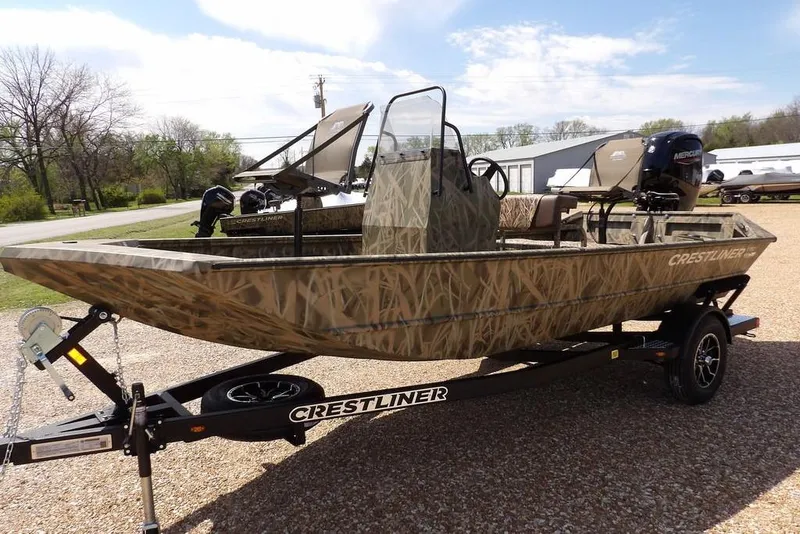 Slide: The Image of 2026 Crestliner 1760 Retriever FCC boat with camouflage design on a trailer. - 4