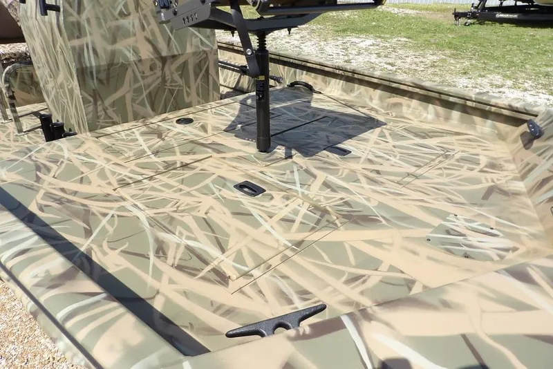 Slide: The Image of 2026 Crestliner 1760 Retriever FCC boat with camouflage pattern on deck. - 5