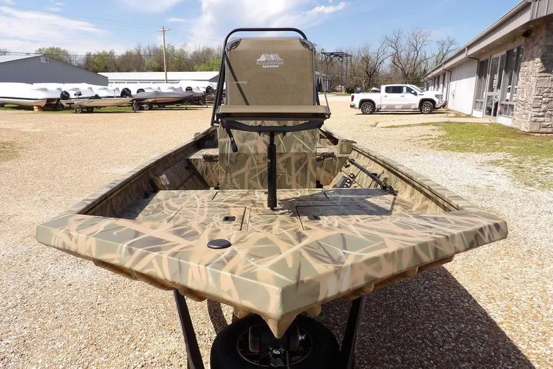Slide: The Image of 2026 Crestliner 1760 Retriever FCC boat with camouflage design in outdoor setting. - 6