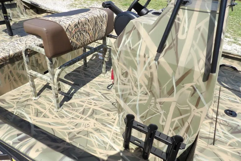 Slide: The Image of 2026 Crestliner 1760 Retriever FCC boat with camouflage design and seating. - 7