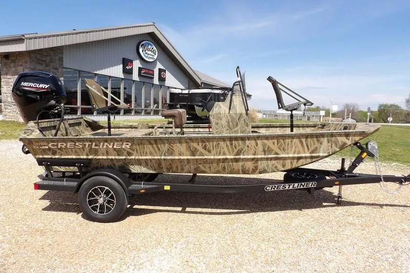 Slide: The Image of 2026 Crestliner 1760 Retriever FCC boat with camouflage design on a trailer. - 9