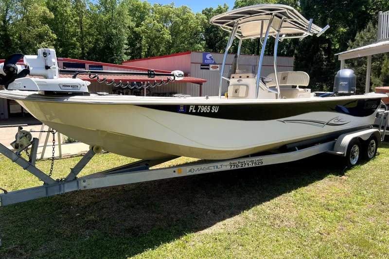 Slide: The Image of 2018 Carolina Skiff 258 DLV boat on trailer, parked outdoors. - 6