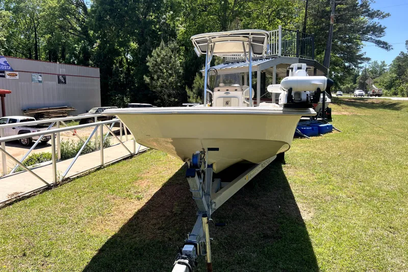 Slide: The Image of 2018 Carolina Skiff 258 DLV boat on trailer, parked on grass, sunny day. - 8
