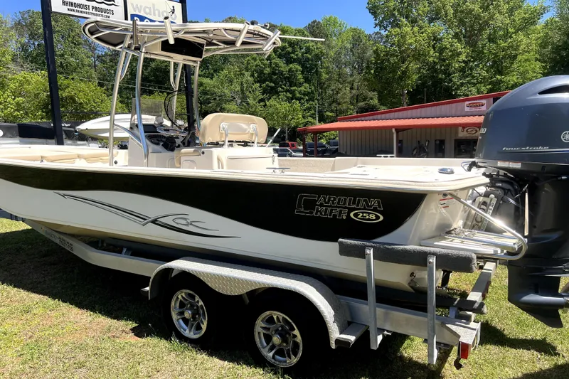 Slide: The Image of 2018 Carolina Skiff 258 DLV boat on trailer, parked outdoors. - 9