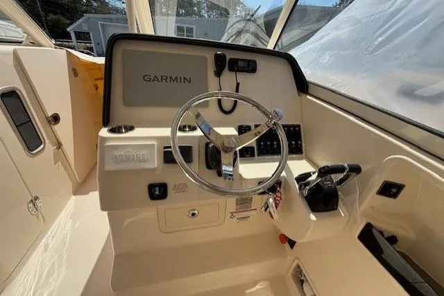 Slide: The Image of Helm of 2018 Grady-White Freedom 325 boat with Garmin navigation system. - 10