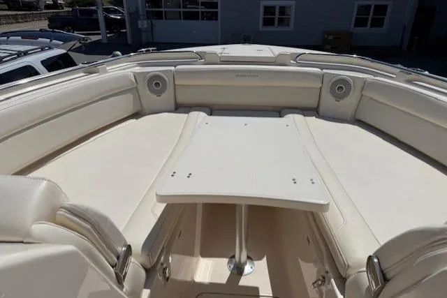 Slide: The Image of 2018 Grady-White Freedom 325 boat interior with spacious seating and table. - 16