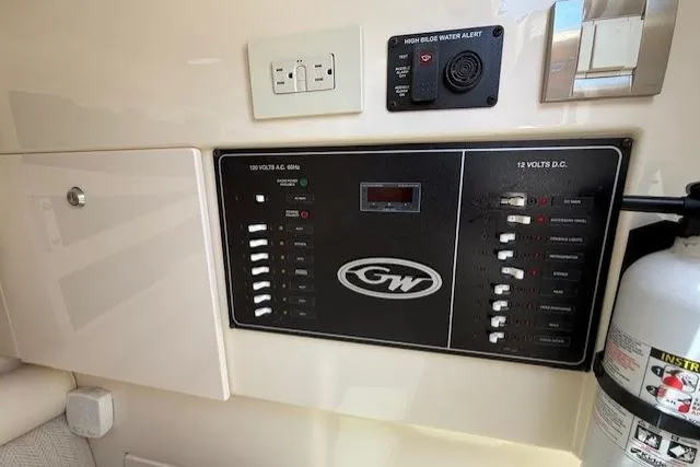 Slide: The Image of Control panel of a 2018 Grady-White Freedom 325 boat with safety equipment. - 21