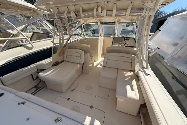 Slide: The Image of 2018 Grady-White Freedom 325 boat interior with spacious seating and helm area. - 24