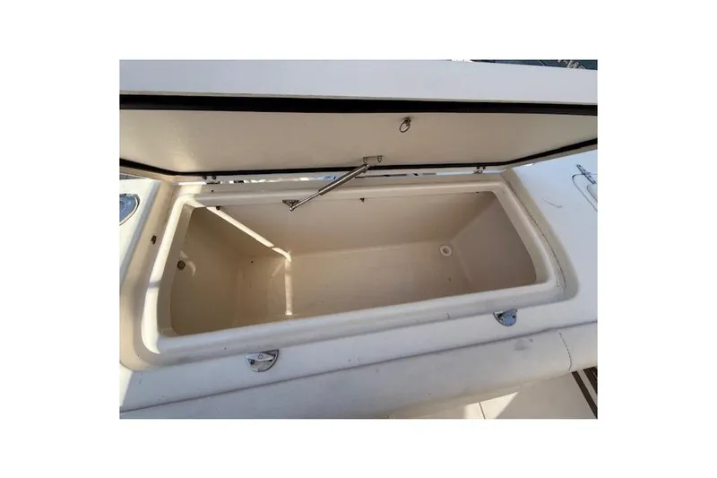 Slide: The Image of Open storage compartment on 2018 Grady-White Freedom 325 boat, showcasing spacious interior. - 26