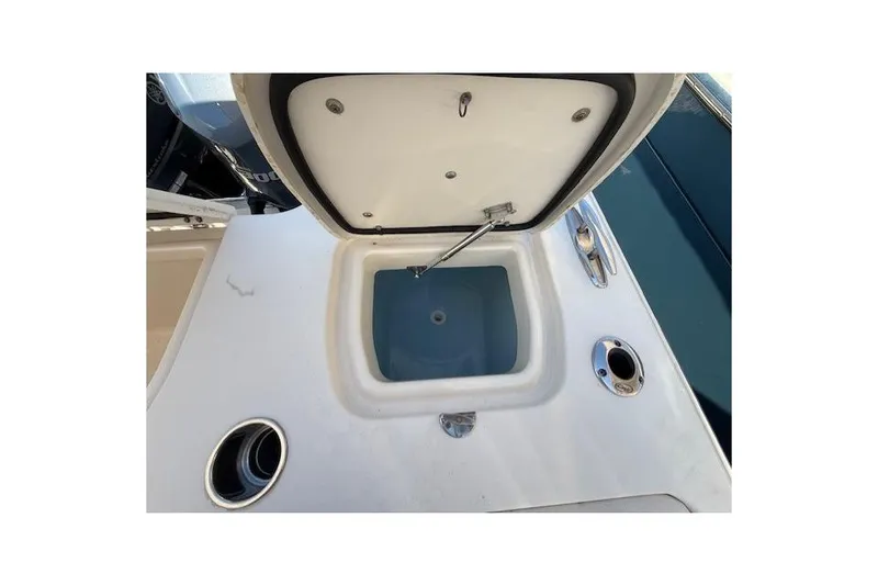 Slide: The Image of Open storage compartment on 2018 Grady-White Freedom 325 boat deck. - 27