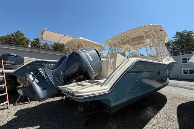 Slide: The Image of 2018 Grady-White Freedom 325 boat with Yamaha engines, parked outdoors. - 3