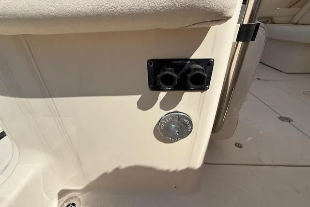 Slide: The Image of 2018 Grady-White Freedom 325 boat interior with power outlets and seating. - 32