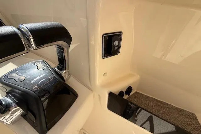 Slide: The Image of Close-up of 2018 Grady-White Freedom 325 boat controls and ignition panel. - 36
