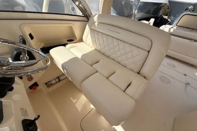 Slide: The Image of Luxurious seating on 2018 Grady-White Freedom 325 boat, featuring elegant white upholstery. - 37