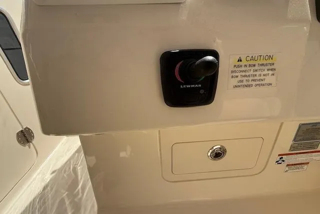 Slide: The Image of Control panel on 2018 Grady-White Freedom 325 boat with caution label. - 38